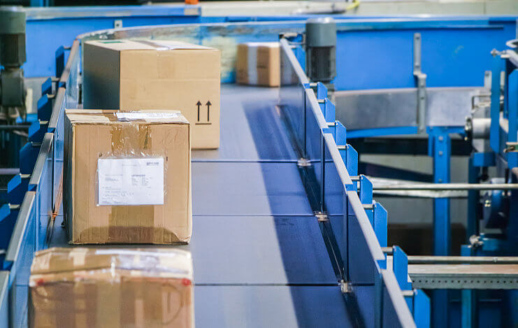 Boxes going down a conveyor: Conveyor Protection Systems